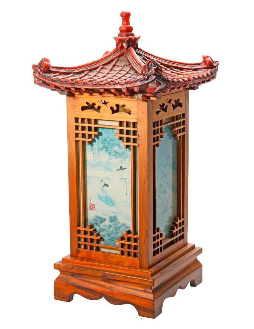 A Chinese Table-Top Lantern Lamp: 20th Century. The wood lantern-form lamp with a plastic pagoda roof-form top. Total approx. 22" x 10 1/2" x 10 1/2". Condition: some losses to roof.