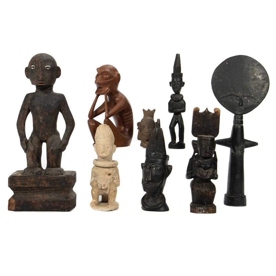 Tribal Art Carved Figures: Including African and various figures. Greatest height 14in. (35cm) Condition: All with minor abrasions.