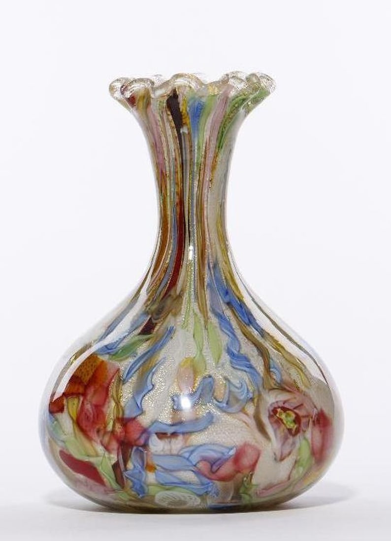 Italian Art Glass Multicolor Vase: The vase with multicolor bands/floral design and gold flecks overlaid on white, with a narrow neck and fluted rim. Approx. 10" high. Condition good.