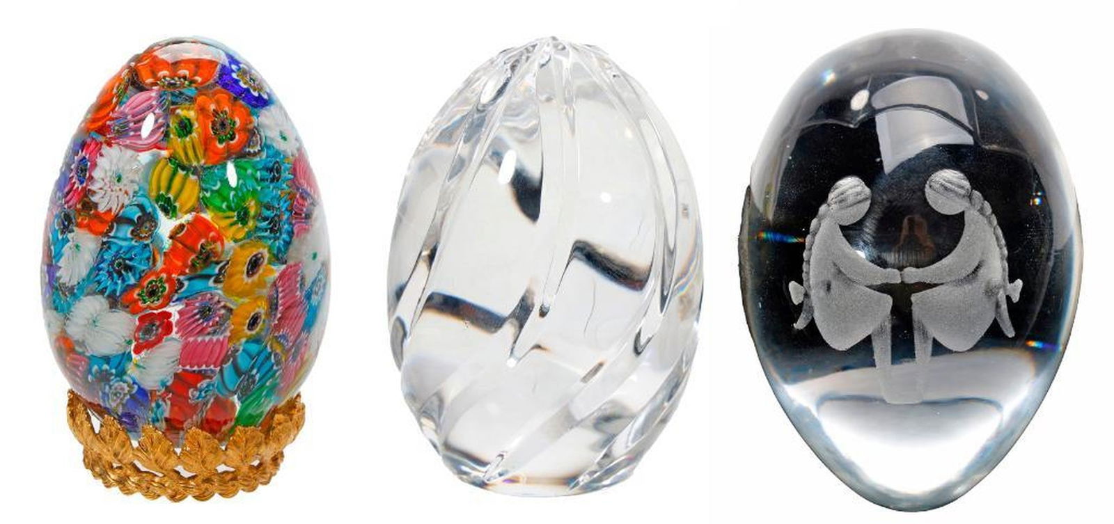 Seven Paperweights: Comprising of a Maude and Bob St. Clair weight with green bubble-centered flowers on a green ground. 2 3/4" x 2 1/2"; a Baccarat/Franklin Mint faceted paperweight with a sulphide rose on a green