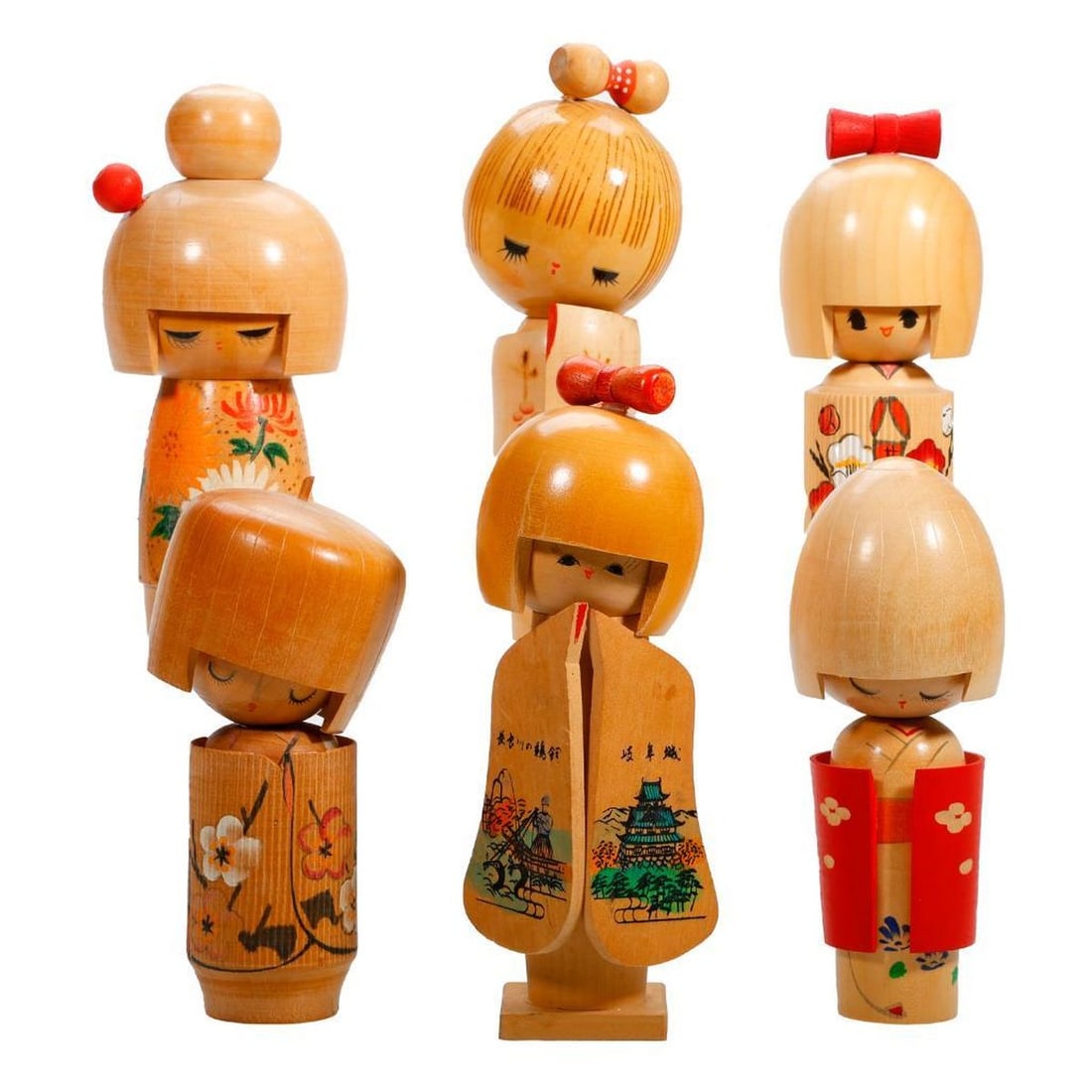 Six Kokeshi Blond Wood Dolls: Comprising five dolls wearing a kimono painted with flowers and having an applied "helmet" or bowl cut hair; a sixth doll having body fashioned as bamboo length, including one holding an hour gl