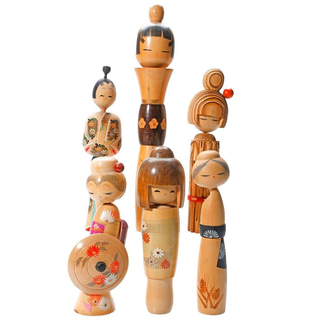 Six Japanese Kokeshi Wood Dolls: Including a thin waisted doll wearing a gold crane kimono, 13..25"h (tallest); a Sosaku Kindai doll with black obi with stenciled fans by Suigai Sato, 8.75"h; lady with an painted