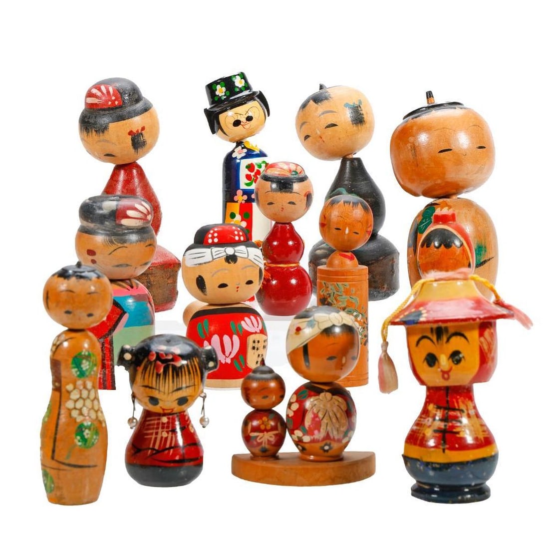 Twelve Small Kokeshi Bobble Head Wood Dolls: Each with bobbling round heads and cylindrical or barrel form bodies, heights range from 1.5" to 5". Condition: nicks, some minor paint loss and wear to pant consistent of age and use