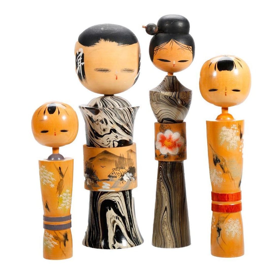 Four Japanese Landscape Painted Kokeshi Dolls: Including two dolls wearing a painted black and white marbled kimono; the first with an applied wood obi with a ink brush painted mountain landscape with a hut 10.5"h x 3.5"h ; the seco