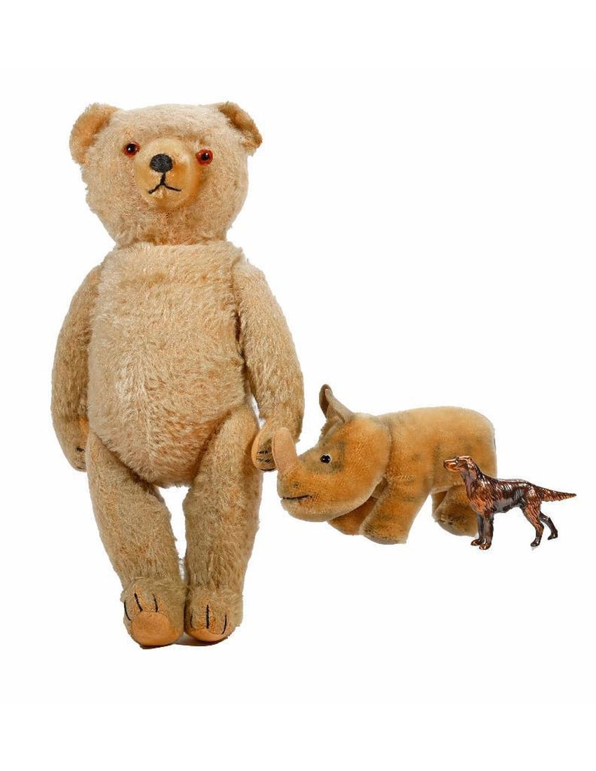 Vintage Teddy Bear and Rhino.: A 17in jointed teddy bear with pupil/button eyes; no tag. Together with a Steiff "Nosy" Rhinoceros, 7 1/2in long; with string around neck, but paper tag missing. Together with a bronze-toned metal