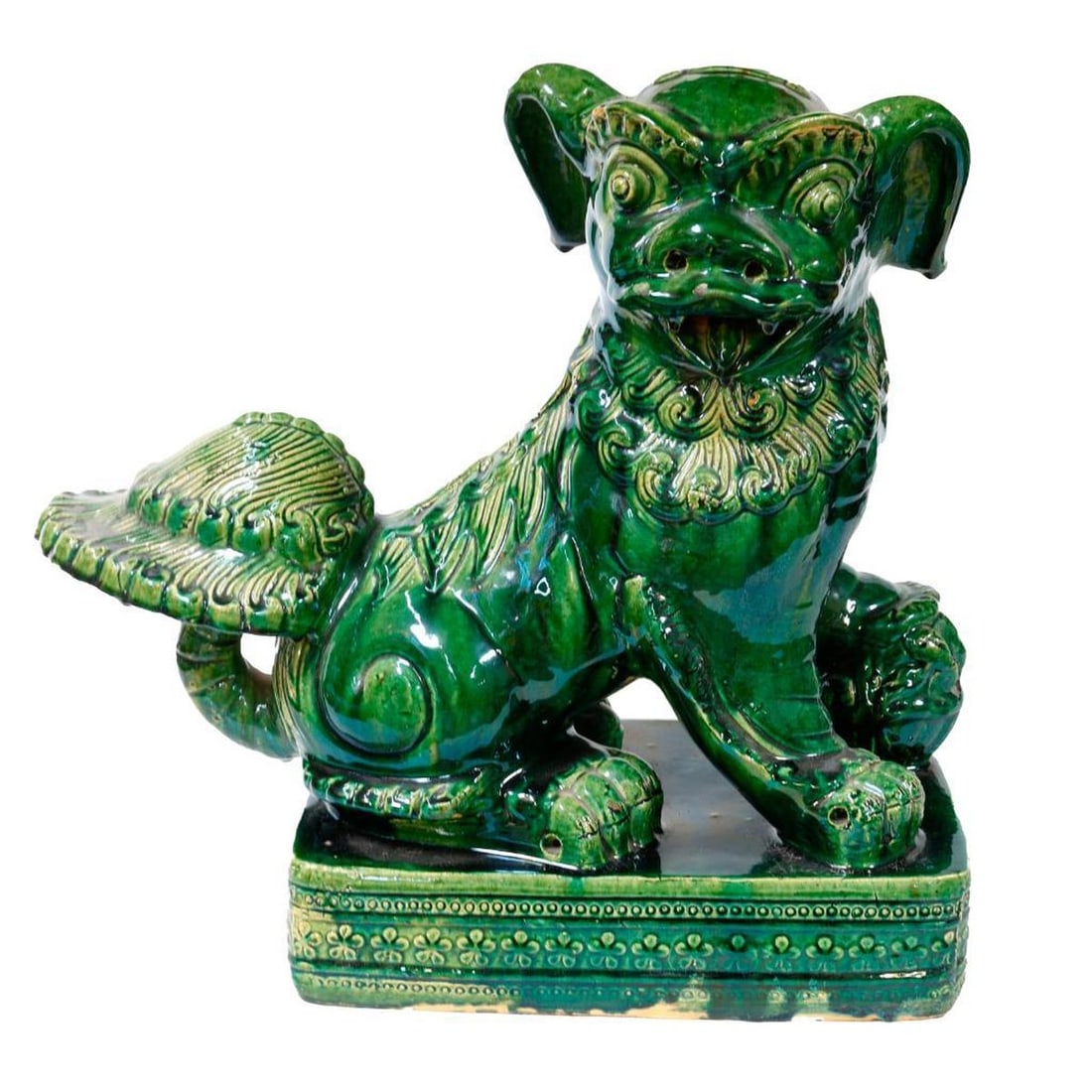 Chinese Ming Style Fu Lion Roof Tile: The dark green glazed ceramic figure of a beast, rising on a platform base, decorated with raised bosses and flowerheads, 21.5"h x 24"w x 10"d. Provenance: The Robert A. Unger Trust