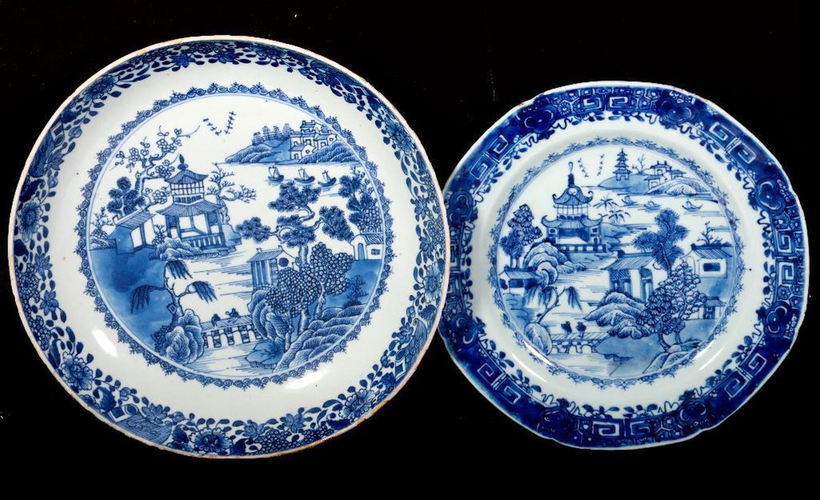 Two Chinese Export Blue and White Dishes. Property of Alton F. Irby III: Circa 19th Century. A blue and white porcelain dish, with a smaller plate, both with pagoda landscapes; unmarked. Diam. 9" and 10 1/2". Condition: the dish with chips/losses to glaze around the rim;