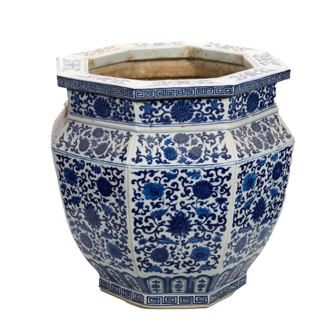 Chinese Blue & White Jardiniere: Fashioned in the Ming style, the sides of the hexagonal form painted in dark cobalt with flowering lotus vine reserves, 14"h x 13.25"w