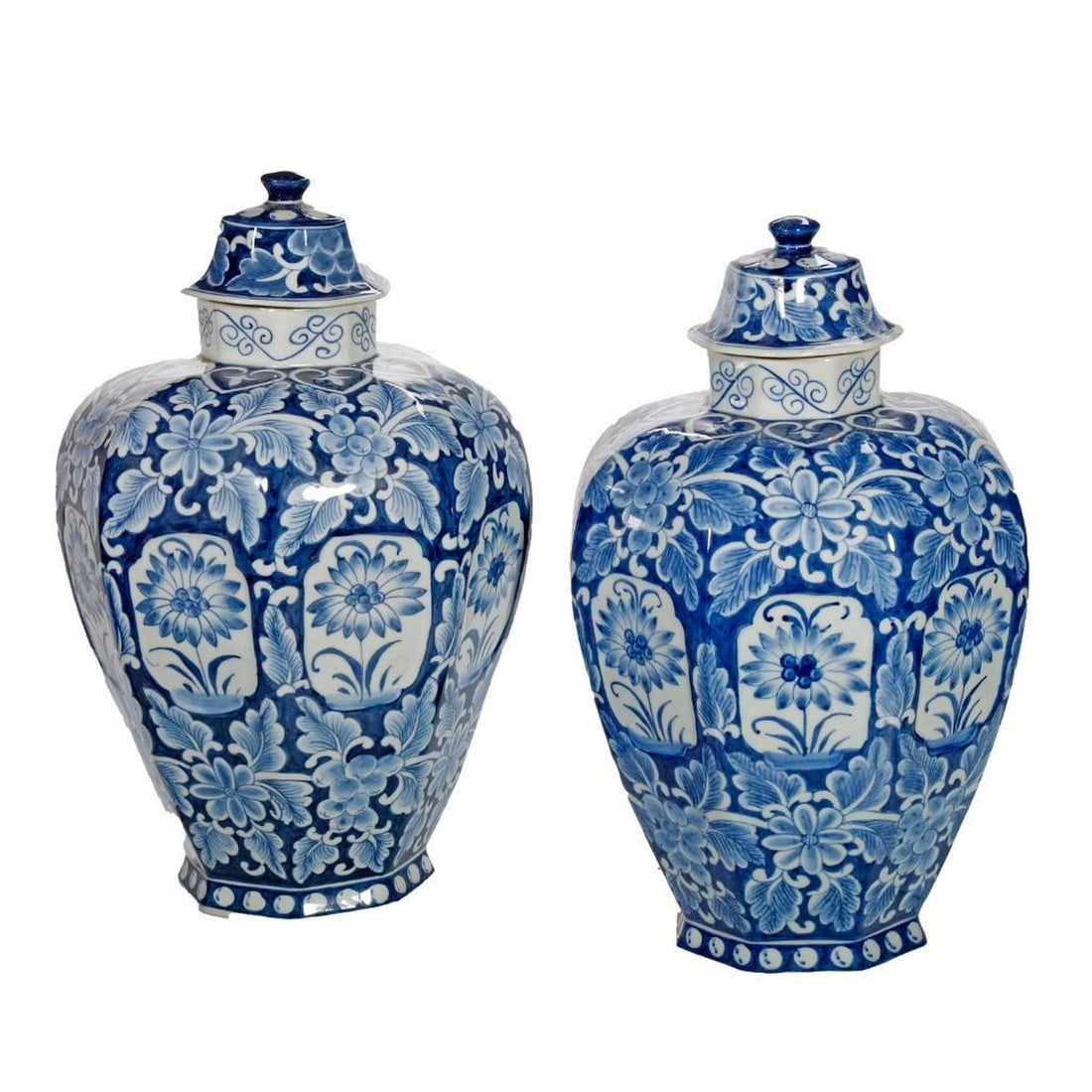 Pair of Chinese Blue and White Porcelain Jars: Each large lidded jar of tapered octagonal form decorated with fruit branches and blossoms, unmarked; 12 1/2" H x 9" W. Together with wood stands. Condition: the jars in good condition, no