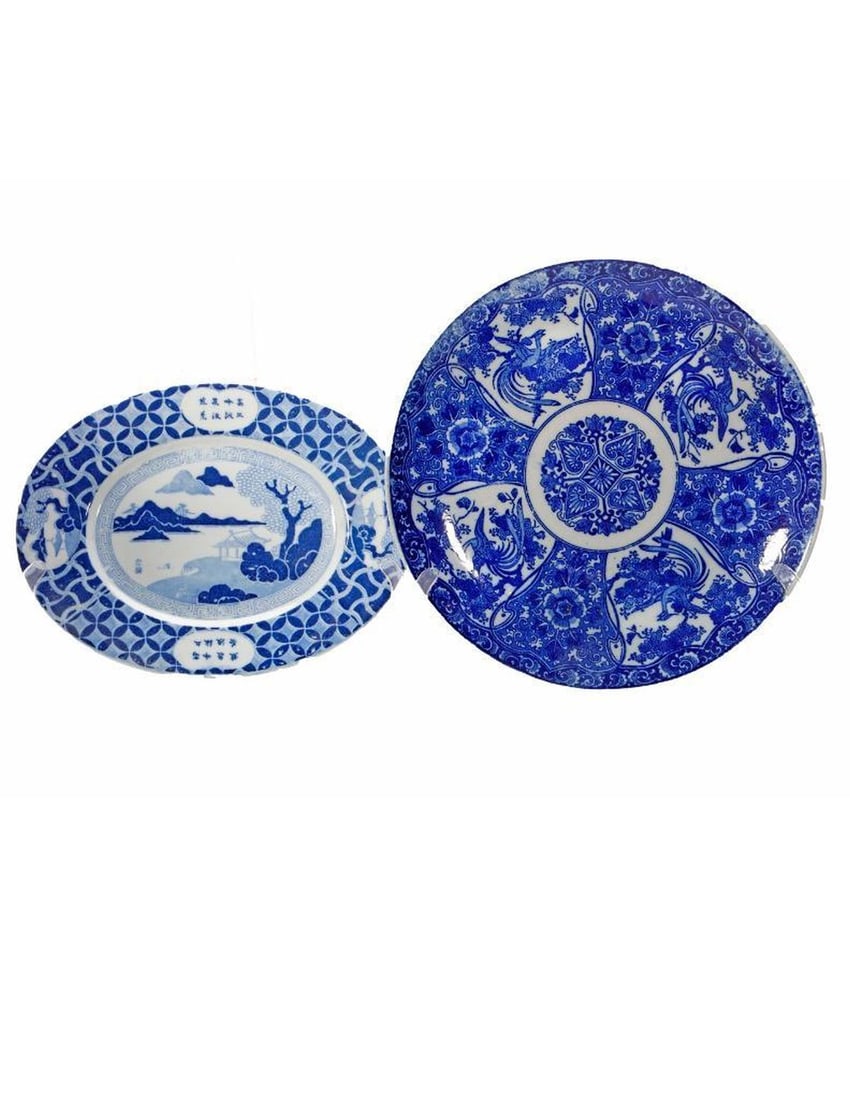 Two Chinese Porcelain Blue and White Plates: Two unmarked Chinese transfer print plates, one round with Phoenix design (diam. 12"); the other a small oval dish with landscape motif (11" x 8 1/2"). Condition: the round dish with one rim chip, the