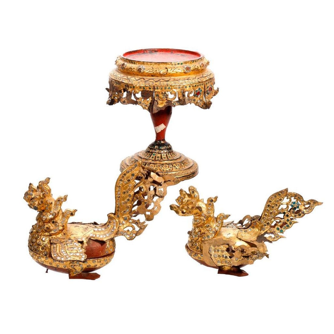 Graduated Pair Burmese Hintha Betel Nut Boxes: Late 19th Century/Early 20th Century. Each gilt lacquered openwork goose form boxes made from metal, papier mache and wood, inlaid with red glass cabochons and small clear or sea green mirro
