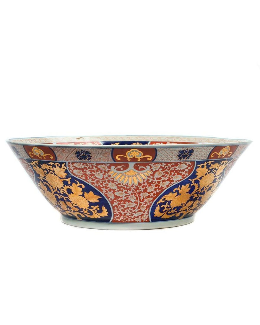 Large Fukagawa Style Porcelain Bowl: A large Fukagawa style deep bowl painted with a leaping carp within a cartouche of flower heads, height 9 1/4" x diam. 27." Japan, c. 1900. Condition: no chips or cracks found.