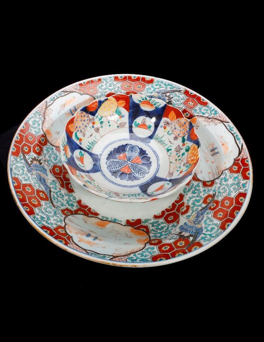 A Japanese Imari Platter, and a Bowl.: The large dish/platter with crane motif border decoration interspersed with landscape scenes; mark to base; diam. 17 3/4". CONDITION REPORT: wear to glaze, especially landscape scenes; scattered