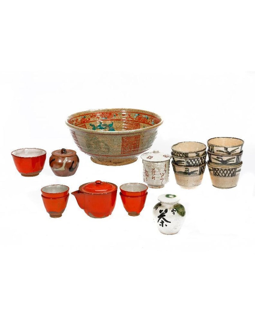 Assorted Group of Asian/Art Pottery.: A crackle glazed bowl (9 3/8in diam.); six cups; lidded jar (3 1/4in h); another small lidded jar (3 1/4in h); oval bowl, inscribed on base (2 1/4in h x 5in w); red-glazed lidded vessel with spout (3i