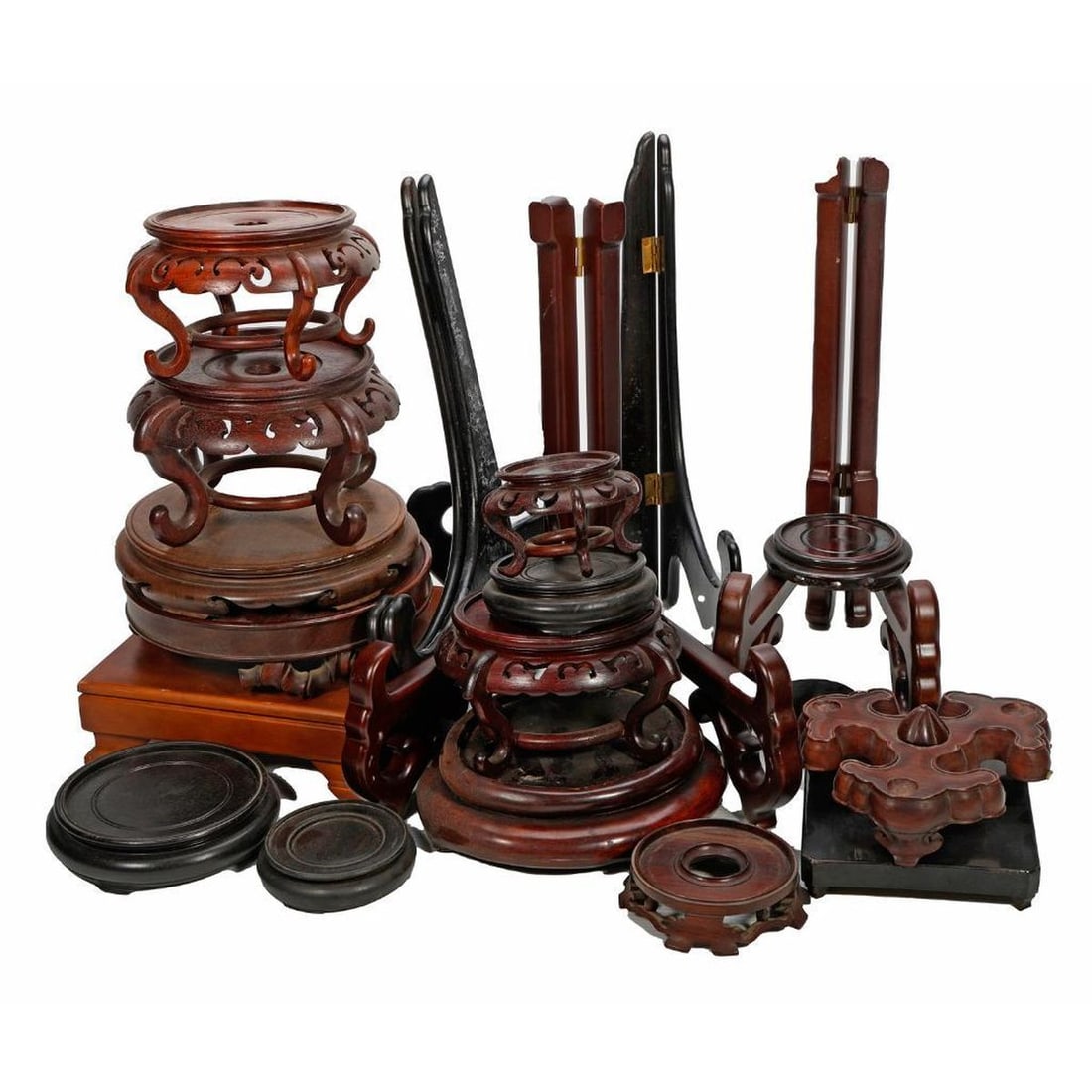 An Assorted Group of Wood Display Stands.: A grouping of carved wood vase, bowl, and other Asian decorative art stands.