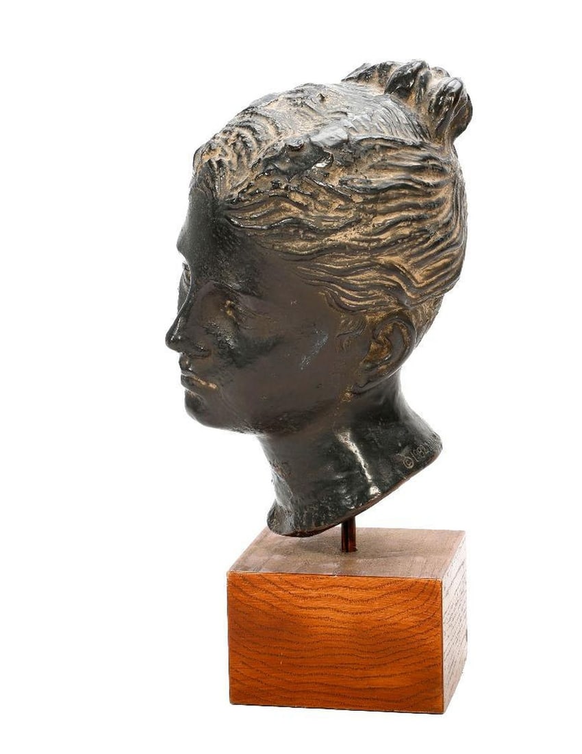 MMA Bust of Aphrodite: A contemporary Metropolitan Museum of Art head of Aphrodite, fabricated in composite, painted black and mounted on a wood stand; total height 14". Stamped: 1982 MMA. FROM THE FAMILY OF CAPTAIN