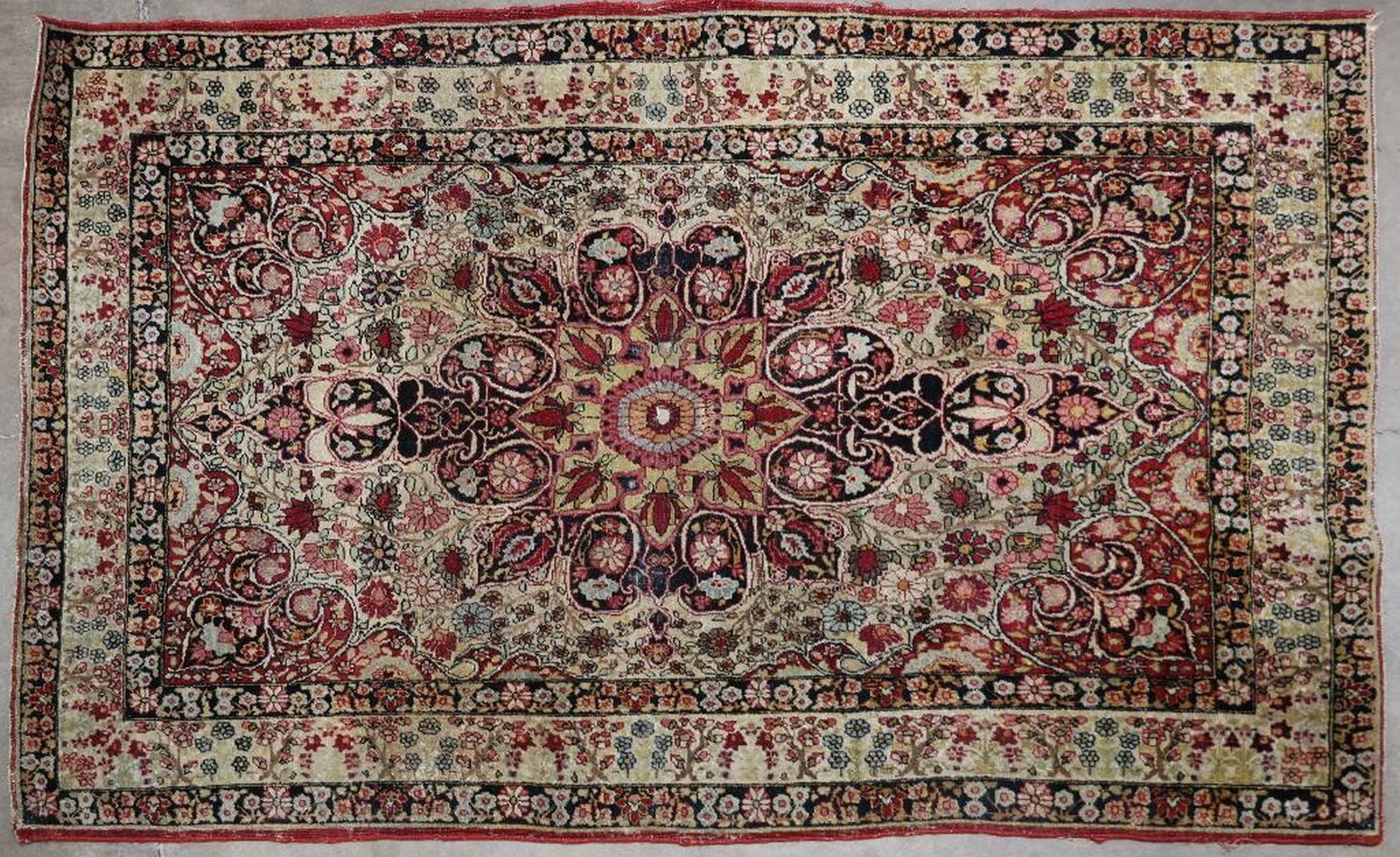 Kirman Carpet: Size approximately 4 feet 2 inches x 6 feet 2 inches.
