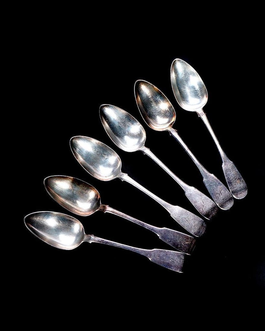 Six Scottish Sterling Serving Spoons: Edinburgh, monogrammed "H"; marked "AM [castle] [wreath] n [profile] JS". Approx. total 393 grams.