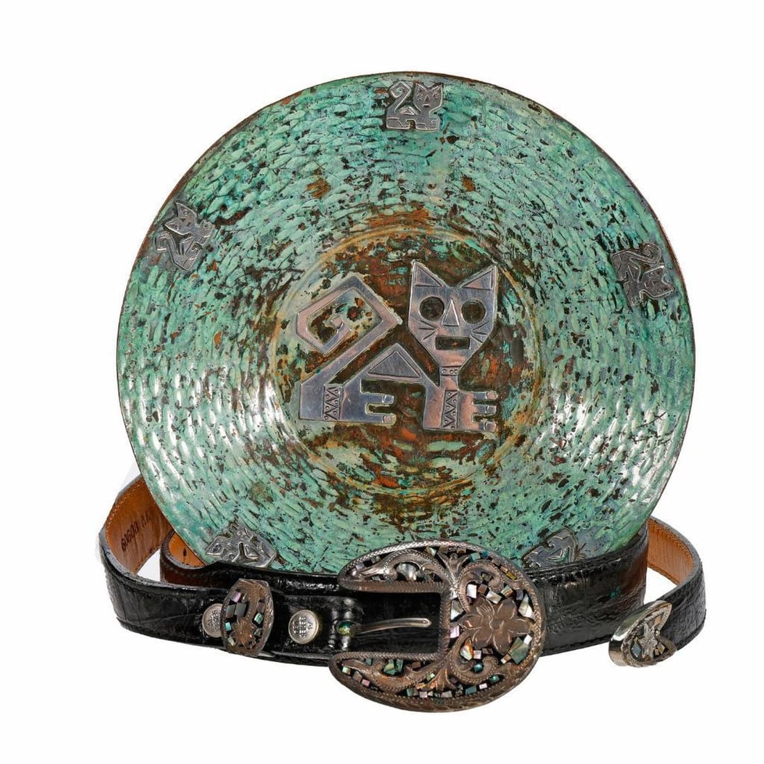Peruvian Silver Inlaid Copper Plate and Al Beres Silver Inlaid Belt: A Peruvian verdigris patinated hand wrought copper shallow bowl centering a stylized cat, the rim with a band of smaller cut out figures of cats, stamped "OSM/Peru" 7.75"d; and an Al Beres mother of p