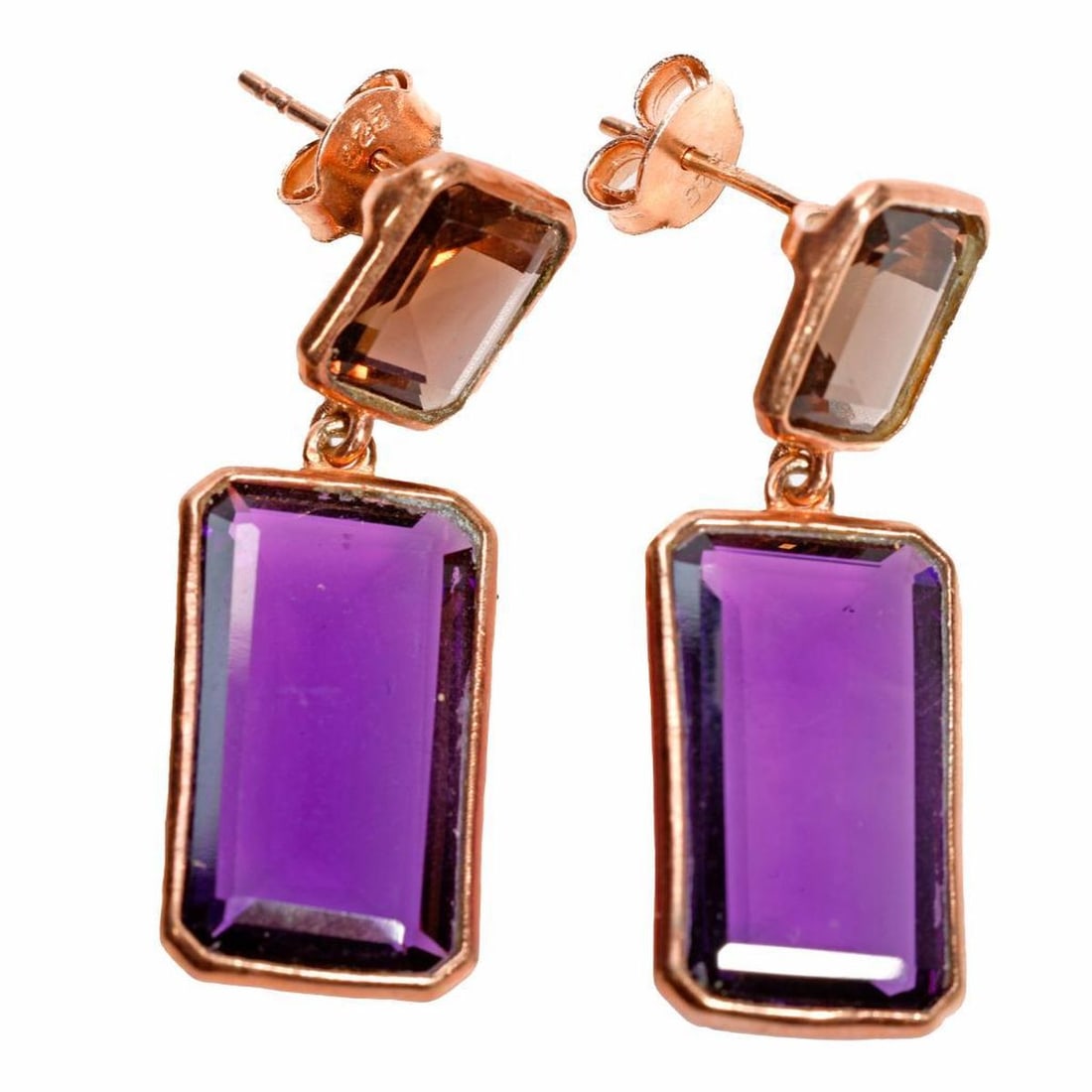 A pair of amethyst and smoky quartz: each emerald-cut smoky quartz suspending a rectangular-cut amethyst, bezel-set in gold plated sterling silver; weighing approximately 8.0 grams; length: 1 1/2 in.