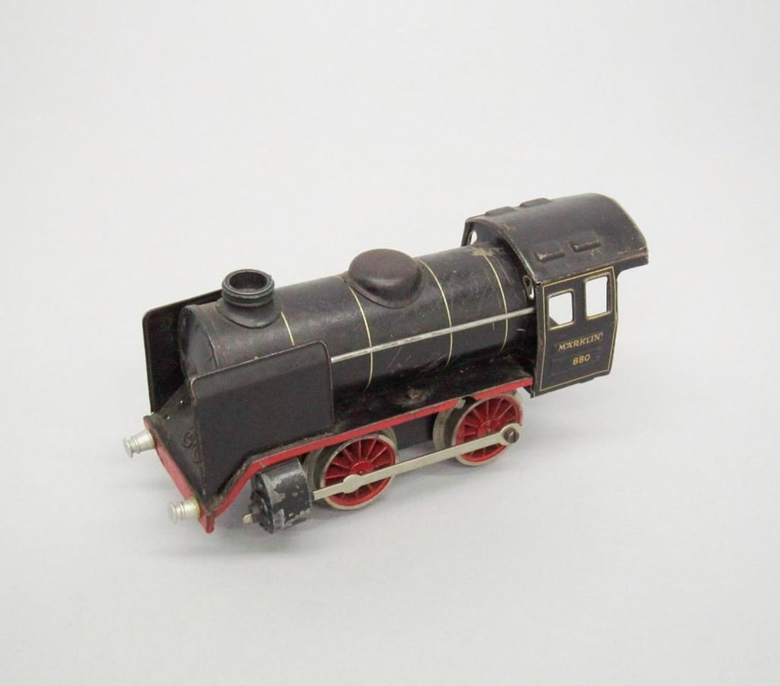 Marklin Electric Train Locomotive Continental 0-4-0 / 880: Toy electric locomotive train; black exterior with red trim; "Marklin 880" printed on sides; "Marklin Germany" printed on lithographed control panel on interior. Date: 1935-1939. Dimensions: 3