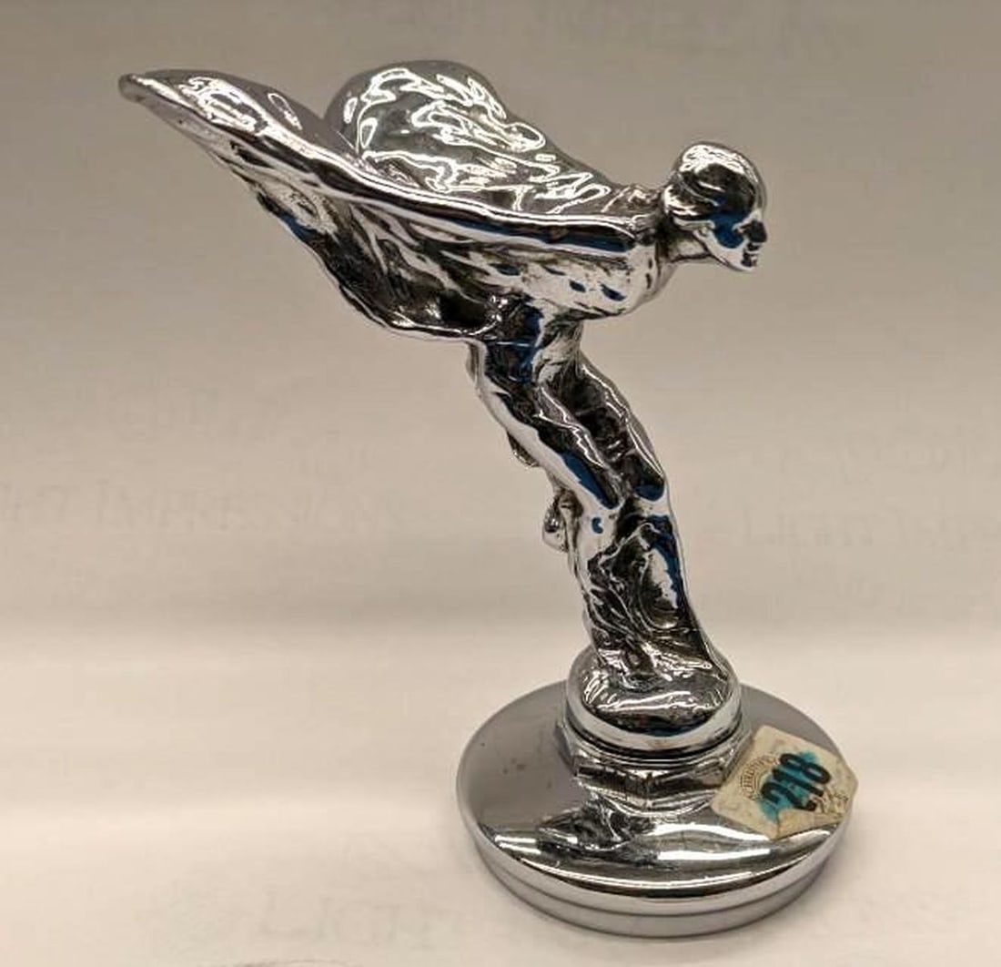 Vintage Rolls-Royce Spirit of Ecstasy Hood Ornament: Circa 1930, the finial based on Charles Sykes (English/American 1875-1950) Spirit of Ecstasy sculpture. This radiator cap is suitable for Phantom or 20/25 hp models. Dimensions: 5.25" x 3.25" x 5" (13