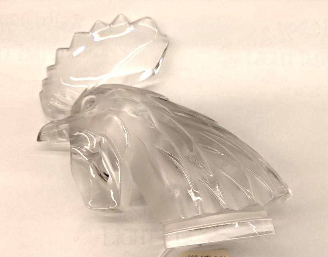 Lalique Frosted Glass Tete du Coq Hood Ornament: Introduced in 1930, the frosted and clear glass car mascot of recent manufacture; etched signature to the underside of base, "Lalique, France". Dimensions: 7" x 6.75" x 3" (17.8 x 17.1 x 7.6 cm) Overa