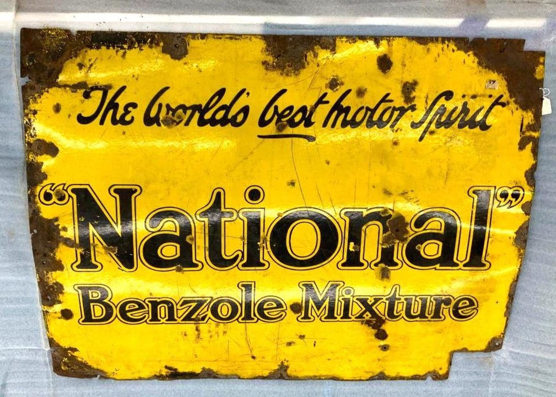 Vintage National Benzole Mixture Enameled Sign: Circa 1930, the rectangular metal advertising sign, enameled in yellow, headed in black cursive script "The worlds best motor Spirit", headed in large script "NATIONAL", above in smaller size "Benzole