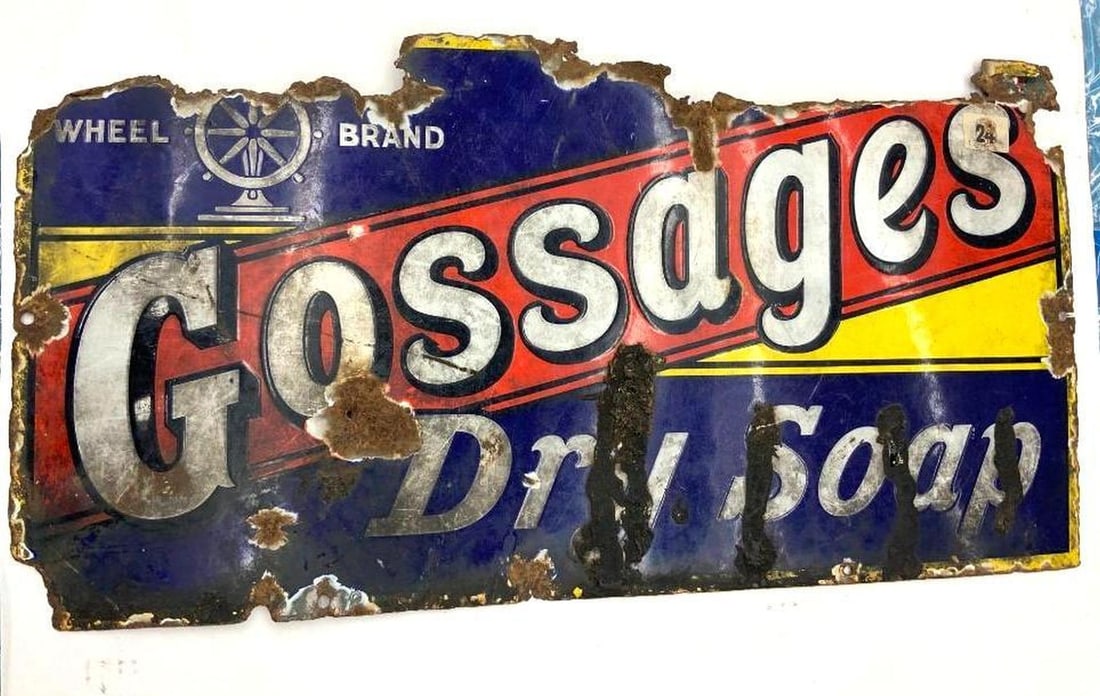 Gossages Dry Soap Advertising Sign: Circa 1930, the cobalt blue enameled advertising sign with red vertical stripe with white lettering reading "GOSSAGES" over "DRY SOAP" in white lettering. Dimensions: 12"h x 24'w (30.5 x 61 cm) Overal