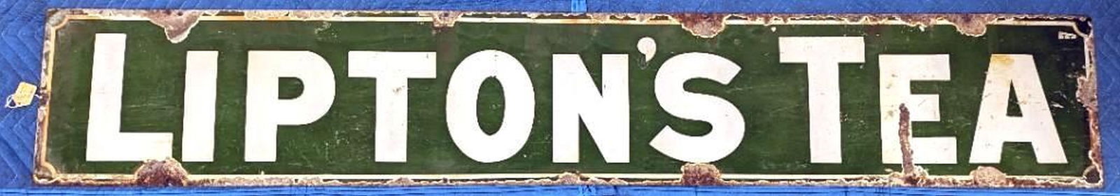 Lipton's Tea Advertising Sign: enameled metal sign. Date: c. 1930; Medium: metal, enamel; Dimensions: 12 x 72 inches (30.5 x 182.9 cm) Overall fair condition, Warped. Rust and enamel loss around edges. and corrosion allover to back