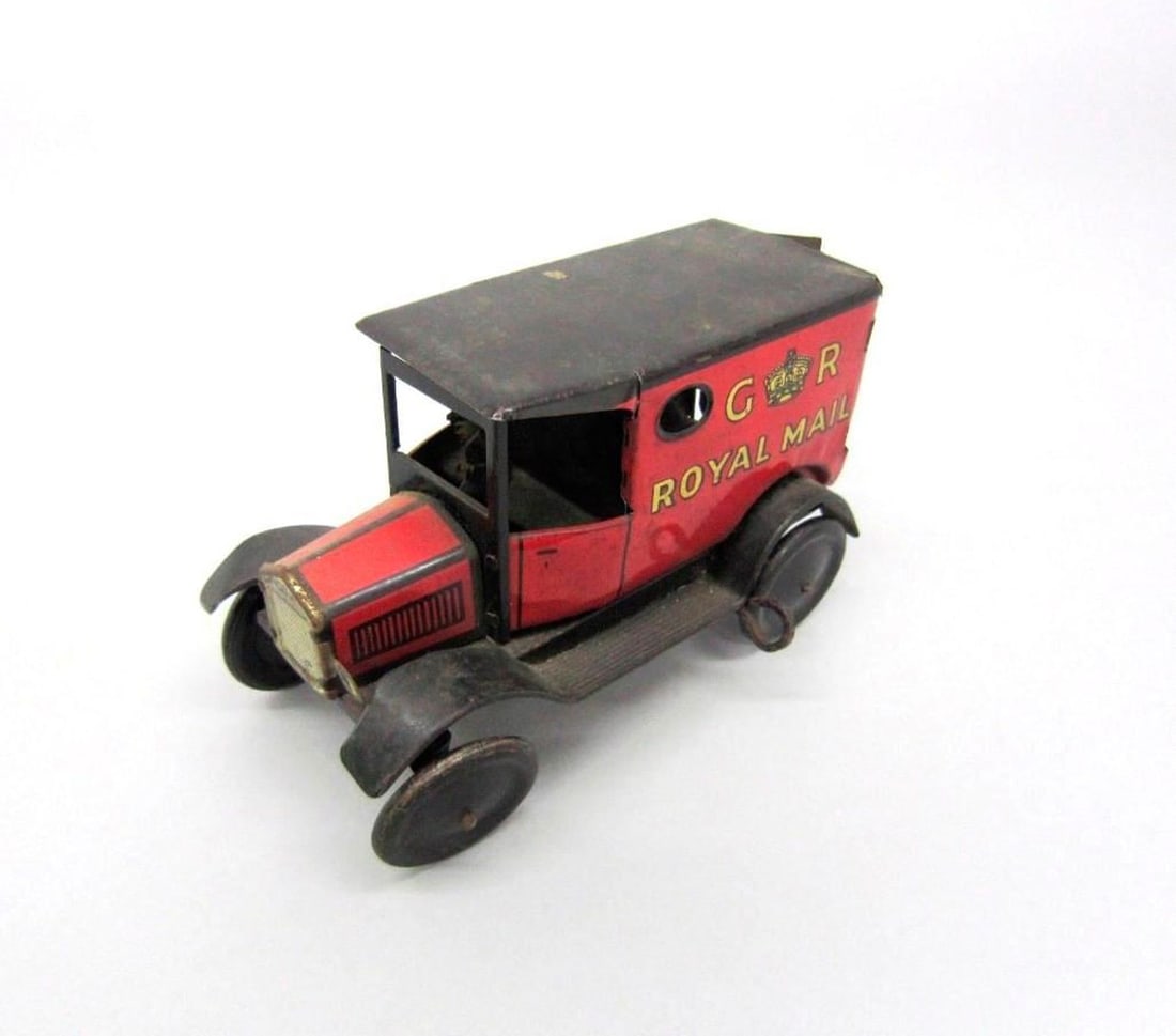 Wells GR Royal Mail Van: Lithographed tinplate red and black GR Royal Mail van with a black roof and a driver. Dimensions: 7" x 4.5" x 2.25" (17.8 x 11.4 x 5.7 cm). Condition: Signs of wear. Rust and some light dents. Provena