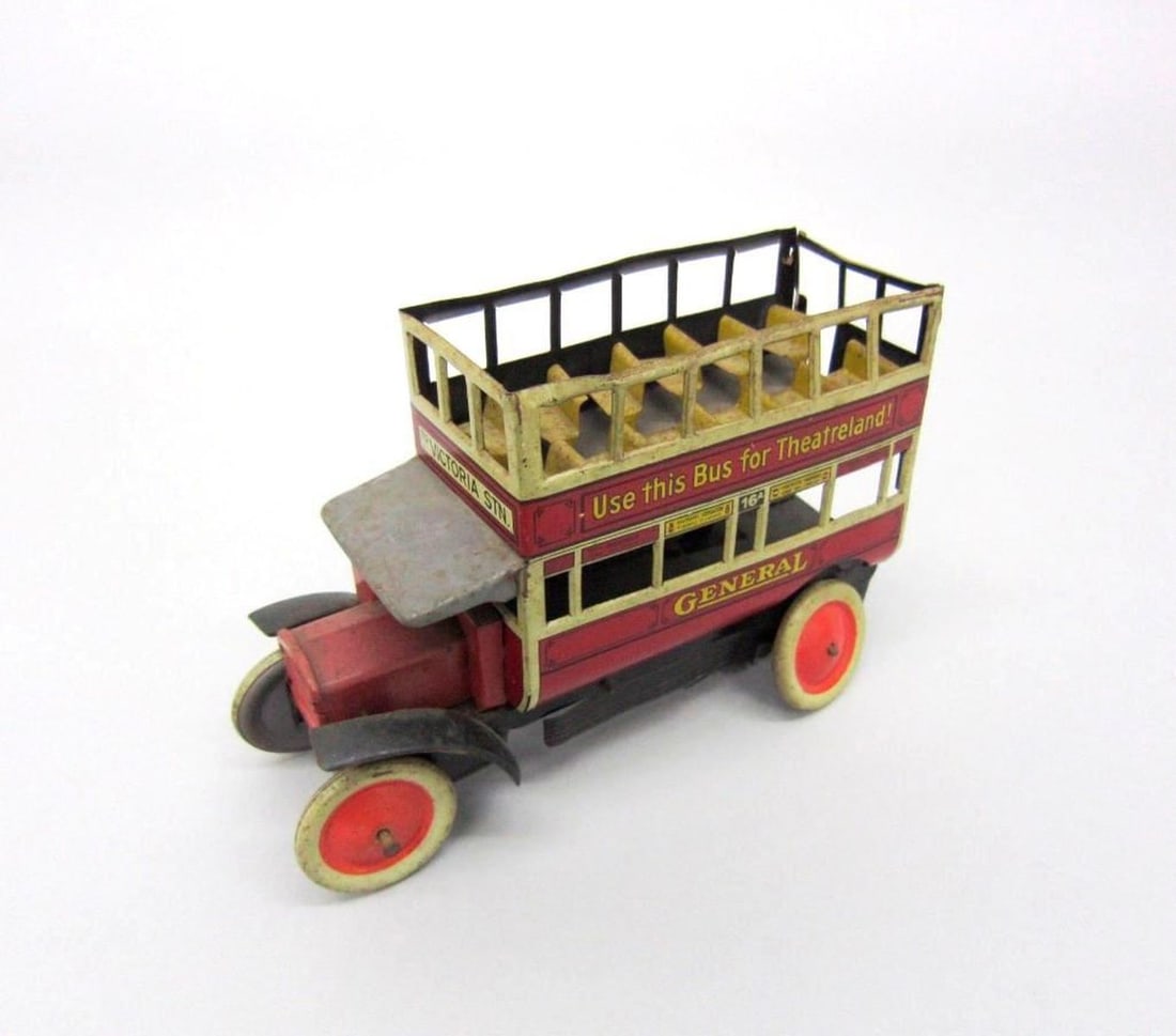British General B Type Omnibus: Red double-decker General B type omnibus with advertising panels and "To Victoria Station" destination sign. Dimensions: 4.5" x 2.25" x 6.75" (11.4 x 5.7 x 17.1 cm). Condition: Dents and dings through