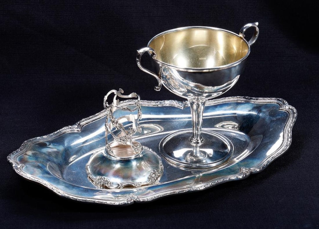 Three Shreve & Co. Sterling Items: Comprising an Art Nouveau bread tray #8978, 12.5"" x 7.5"; an Art Deco loving cup trophy with gilt wash interior to bowl #11346 5.25"h; and a sterling vase base 3.5"h x 1"d. Approx. total weighable 76