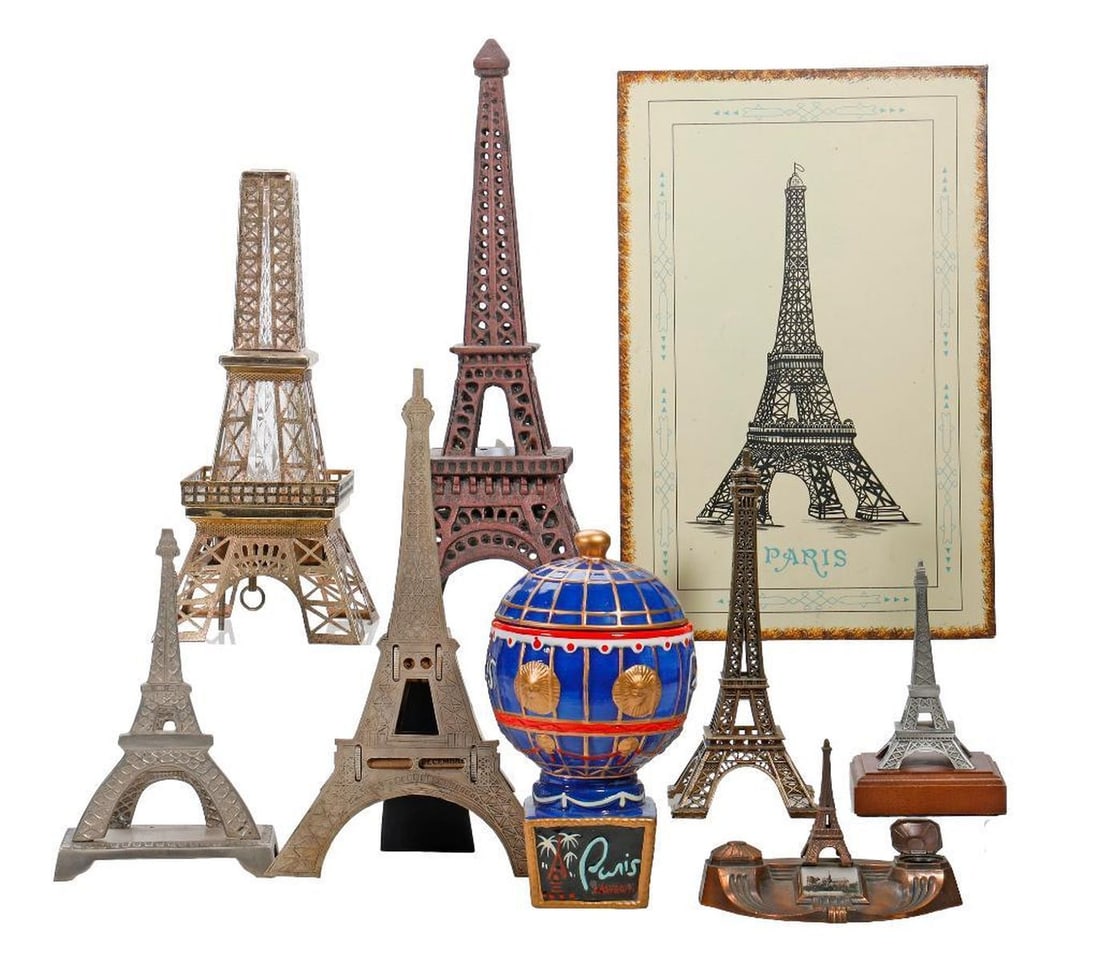 Eiffel Tower/Paris Souvenir Collection: A souvenir collection of various metal, glass, and composite/plastic Paris and Eiffel Tower theme collectibles, including models, coasters, miniatures, bottles, desk objects, and snow globes (loss of 