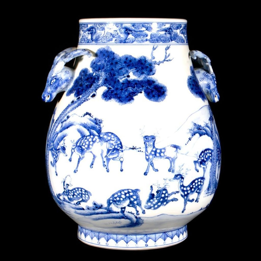 Chinese Blue and White Deer Porcelain Vase.: The pear form with molded deer handles, continuously painted with deer under pine trees, the base with aprochyal six character Qianlong mark, 12" h x 9" d.