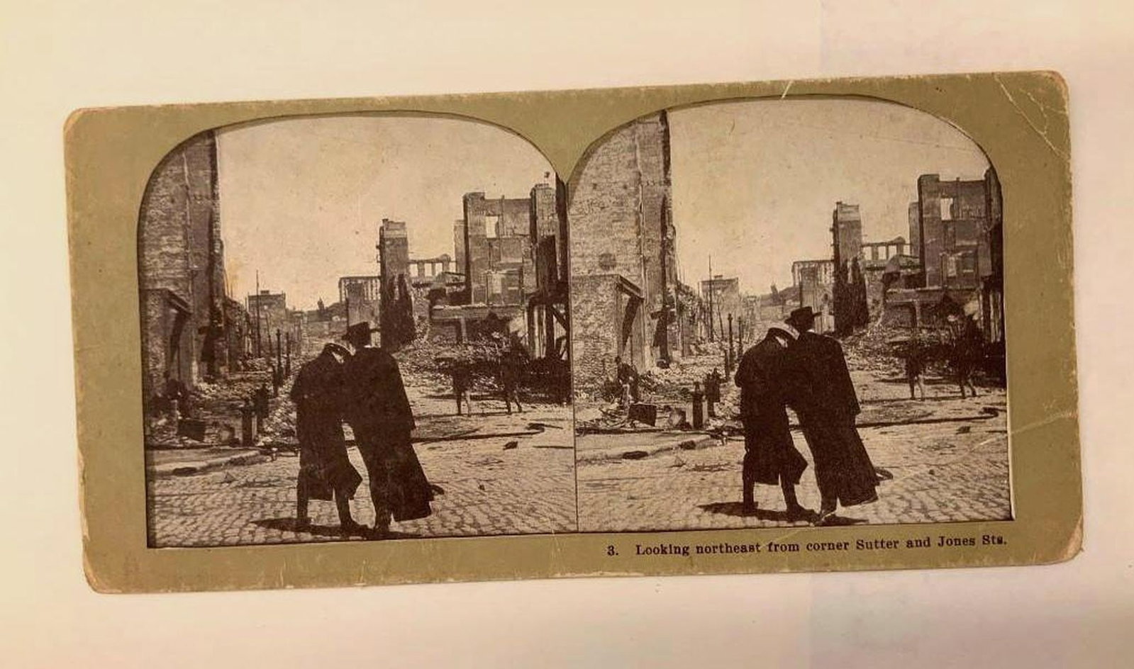 San Francisco Viewing Card of Corner of Sutter and Jones Streets: Featuring a printed double view of the Northeast view from corner of Sutter and Jones Streets. Dimensions: 3.5" x 7" (8.9 x 17.8 cm)