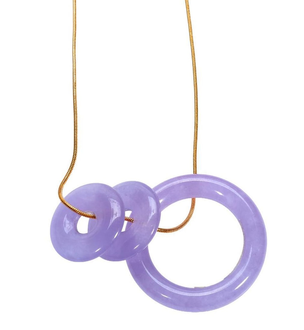 Lavender jade and 18k gold pendant-necklace: the snake chain suspending three carved lavender jade bi pendants, measuring approximately 30.0mm and 18.0mm in diameter; gross weight approximately 12.55 grams; length: 15 1/2 in.