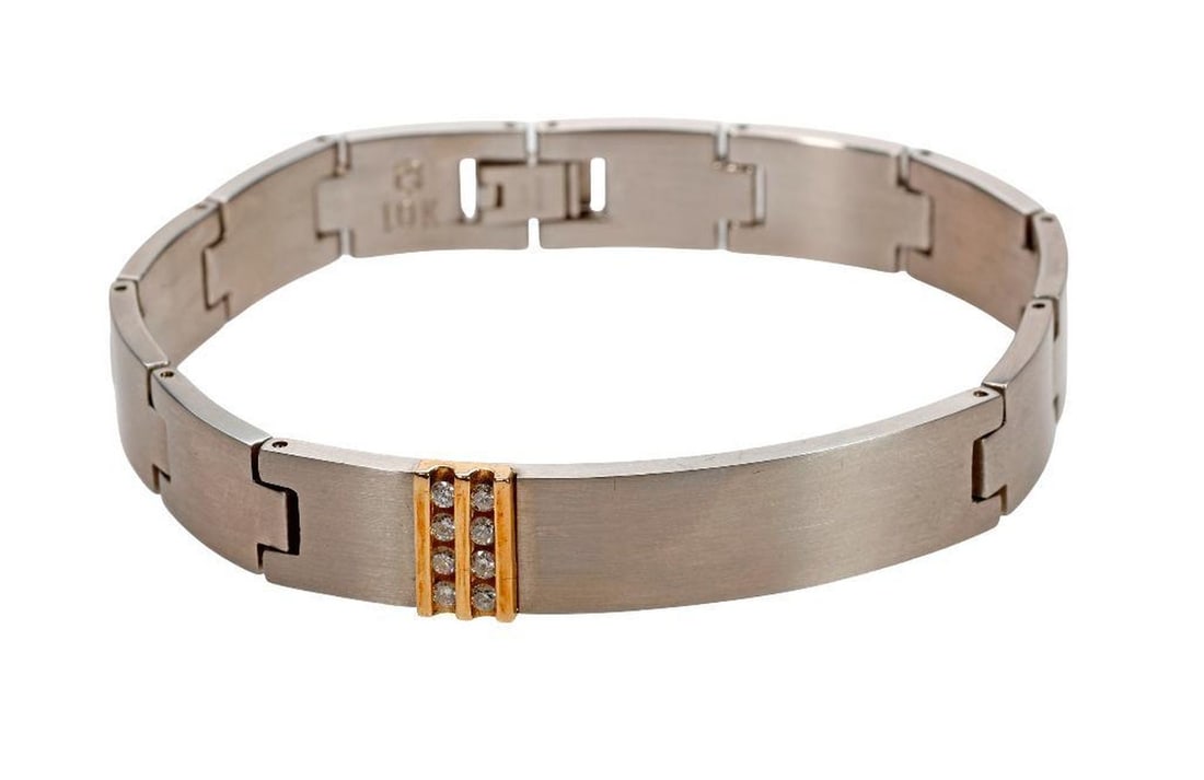 A diamond, 10k gold and stainless steel link bracelet: the elongated stainless steel links accented at the front with eight round brilliant-cut diamonds channel-set in yellow gold; total diamond weight: 0.32 carat; weighing approximately 43.3 grams; lengt