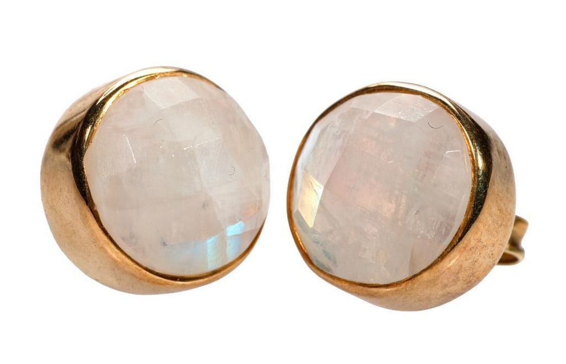 A pair of moonstone, gilt silver and 14k gold stud earrings: bezel-set with two round faceted moonstones, each measuring approximately 11.0mm; weighing approximately 4.8 grams