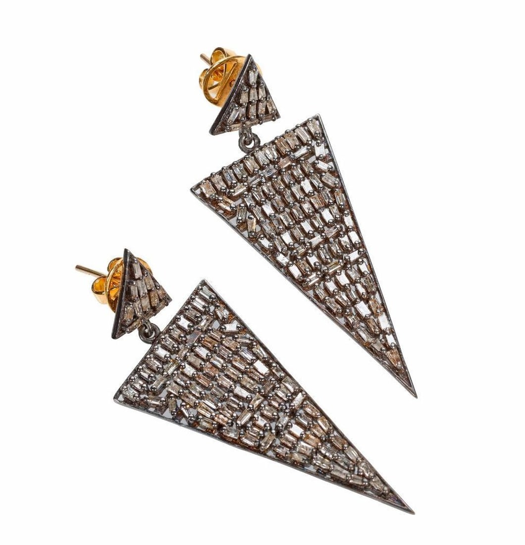 A pair of diamond, blackened silver and 18k gold earrings: of triangular design, set throughout with numerous baguette-cut diamonds, weighing in total an estimated 1.95 carats; weighing approximately 12.8 grams; length: 2 in.