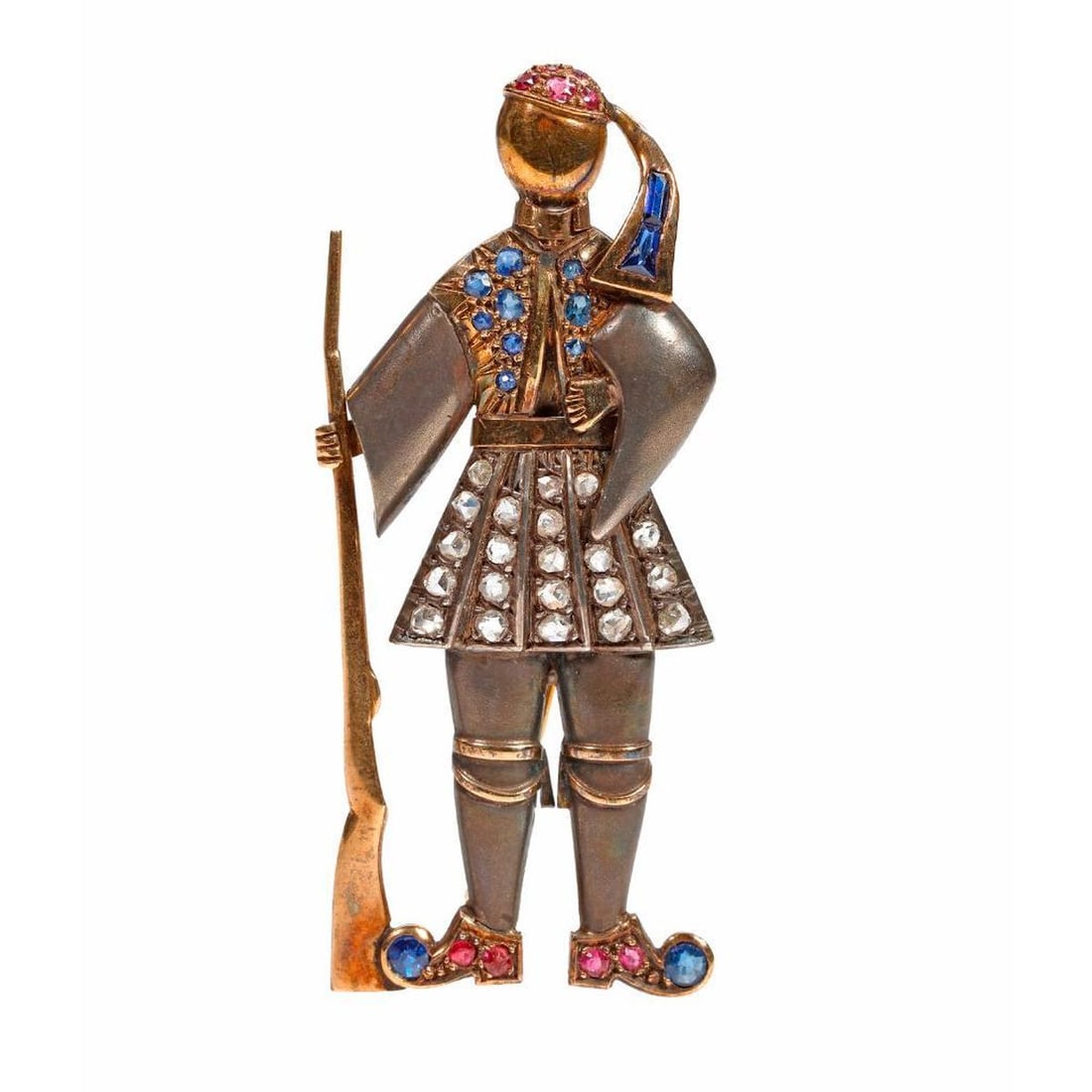 Diamond, ruby, rose gold and silver broch: depicting a French musketeer, designed with 23 rubies and sapphires of assorted cuts, and 21 rose-cut diamonds; weighing approximately 10.87 grams; length: 2 1/8 in. PLEASE NOTE: For combined pu