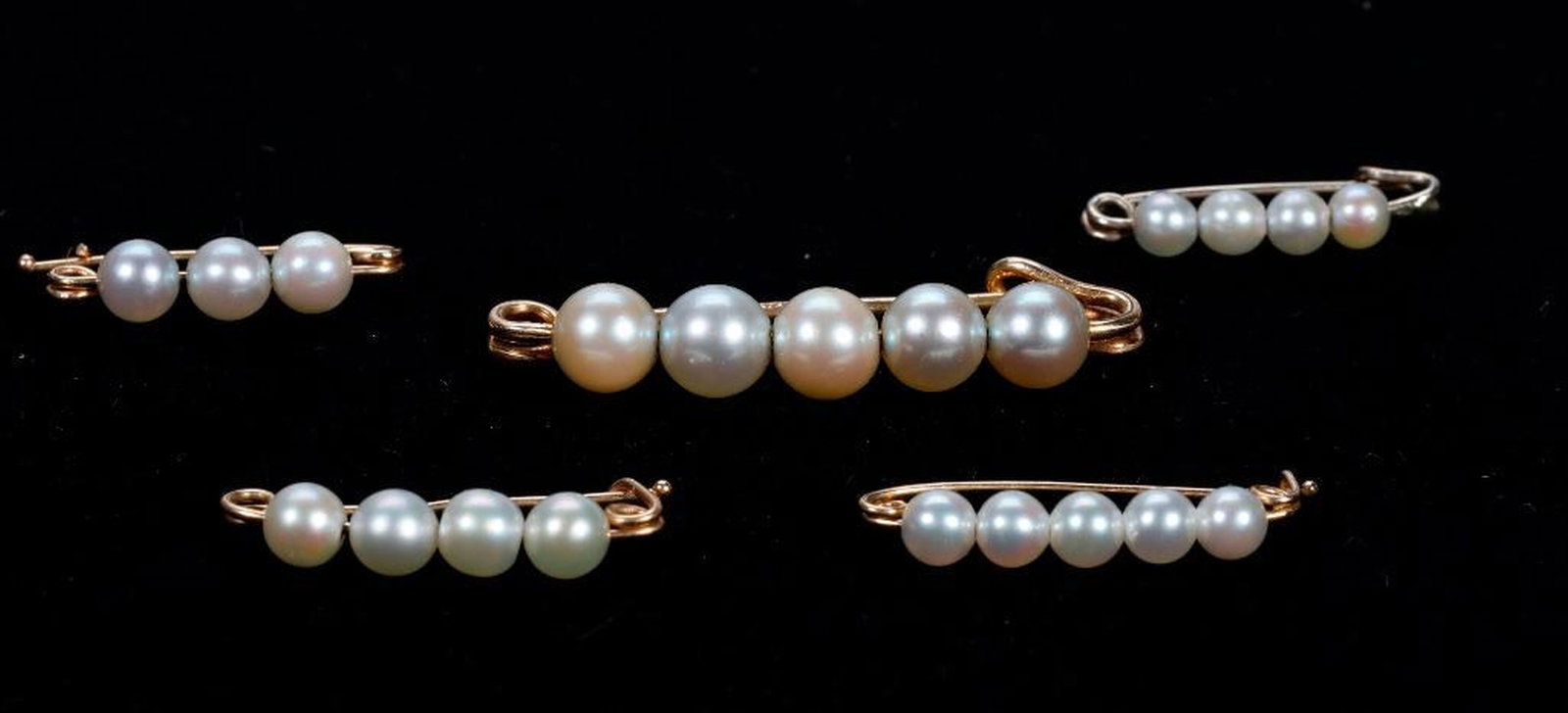 Five cultured pearl and 14k gold safety pins: gross weight approximately 4.50 grams; lengths: 3/4 - 1 1/4 in.