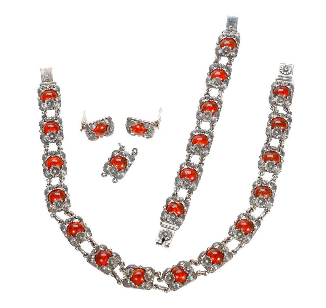 N. E. From amber and sterling silver suite, Denmark: comprising a link necklace, bracelet, and pair of clip earrings, with one extra link; gross weight approximately 113.0 grams; lengths: necklace 15 in, bracelet 6 3/4in., earrings 3/4in.