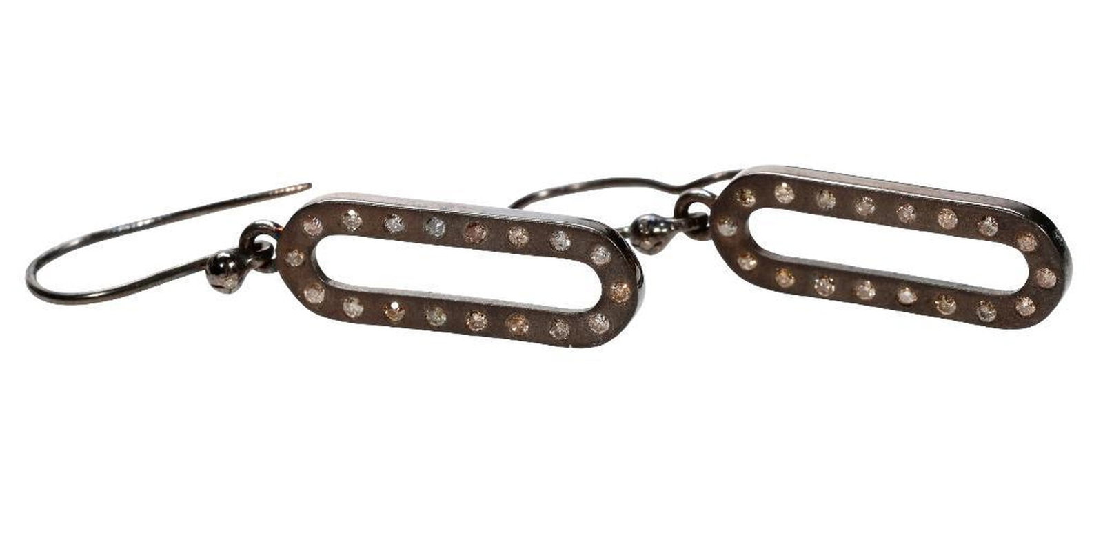 A pair of diamond and blackened silver earrings: the oval-shaped drops set with 36 diamonds weighing in total an estimated 0.80 carat; weighing approximately 5.7 grams; length: 2 in.