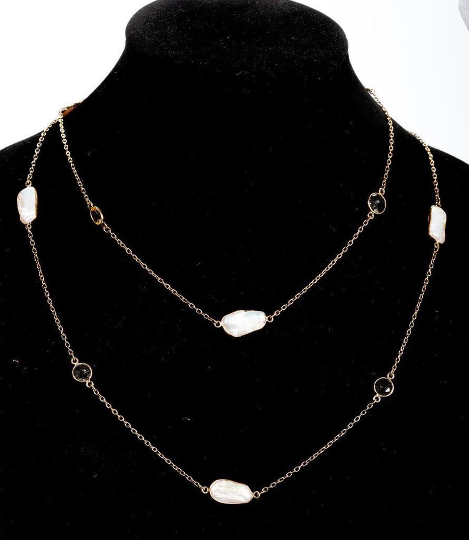 A freshwater cultured pearl, quartz and gilt silver longchain: designed with eight freshwater pearls, and numerous oval and round-cut citrines and rutilated quartz; weighing approximately 20.6 grams; length: 42 in.