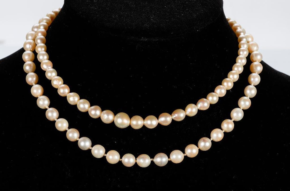 Two cultured pearl and silver necklaces: round to off-round cultured pearls, one with 7.5mm beads, measuring 16 in. long, and one with graduating cultured pearls measuring approximately 9.0 to 5.50mm, measuring 14 in. long