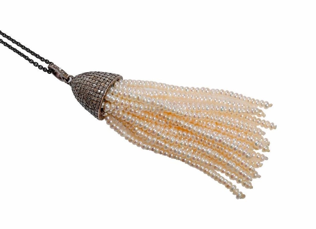 A seed pearl, diamond & blackened silver pendant-necklace: the pendant designed with numerous cultured pearl tassels, the bell-cap and bail set with numerous single-cut diamonds, weighing in total approximately 1.00 carat, completed by a link chain; pendant l