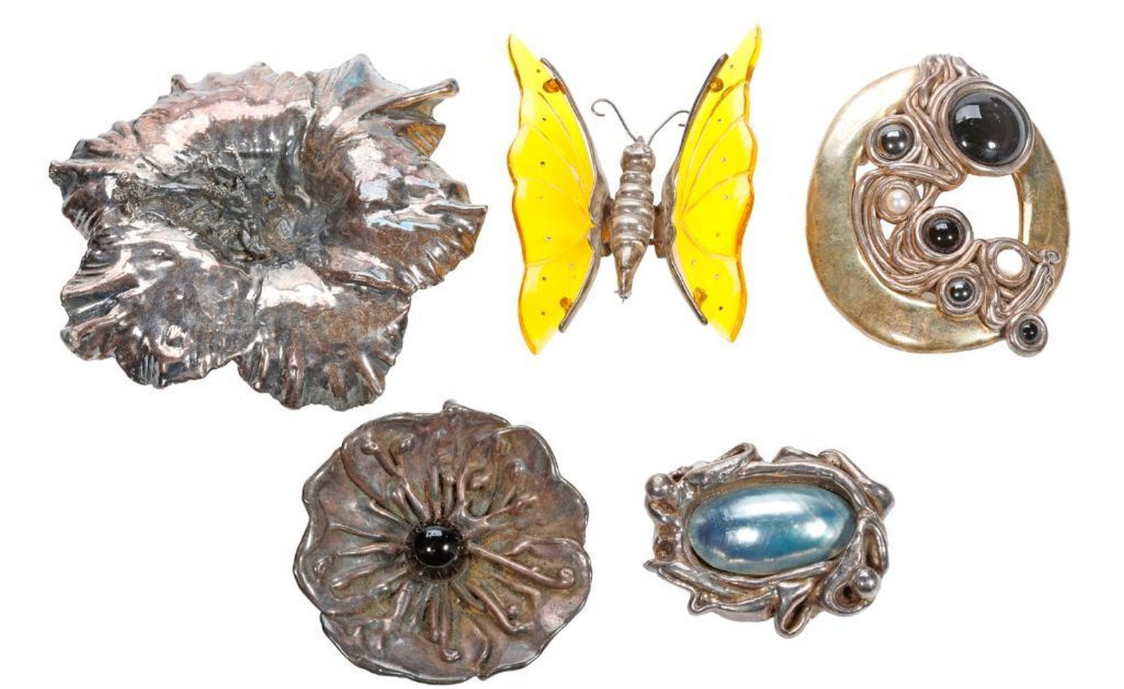 Five silver and gem-set brooches and pendant-brooches: several of electroform design, including floral and en-tremblant, variously set with blister pearl, onyx, hematite, plastic and rhinestone; gross weight approximately 193.2 grams; length range: 2 1/4 