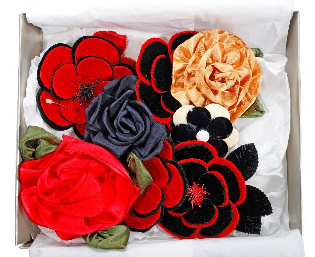 Collection of Vintage Corsage Pins (10): The collection of vintage flower-form corsage pins includes white and brown silk/blend flowers, possibly by Gucci (each in a vintage Gucci box); four red and black velvet flowers, and a yellow silk ro