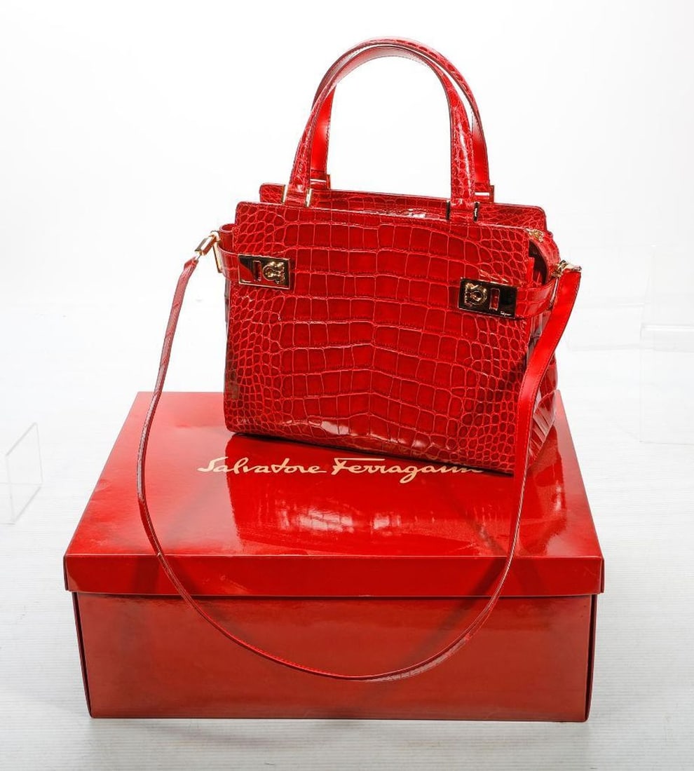 Ferragamo Red Patent Leather Alligator Handbag: A vintage Salvatore Ferragamo, Made in Italy labeled small day tote/handbag with shoulder strap, in patent leather alligator embossed pattern, gold-toned hardware; 8" x 10 1/4" x 4." Excellent vintage